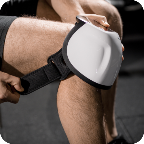man wearing knee massager