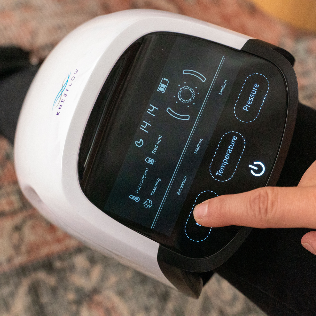 Portable knee massager with heat and vibration therapy